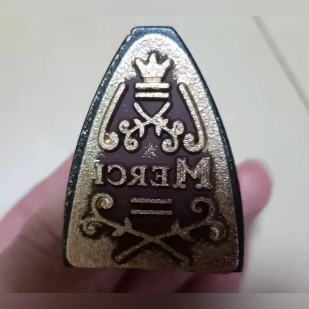$1 FRENCH MERCI STAMP. IRON SHAPED. NEW $1 WITH ANY $10 ORDER OR MORE